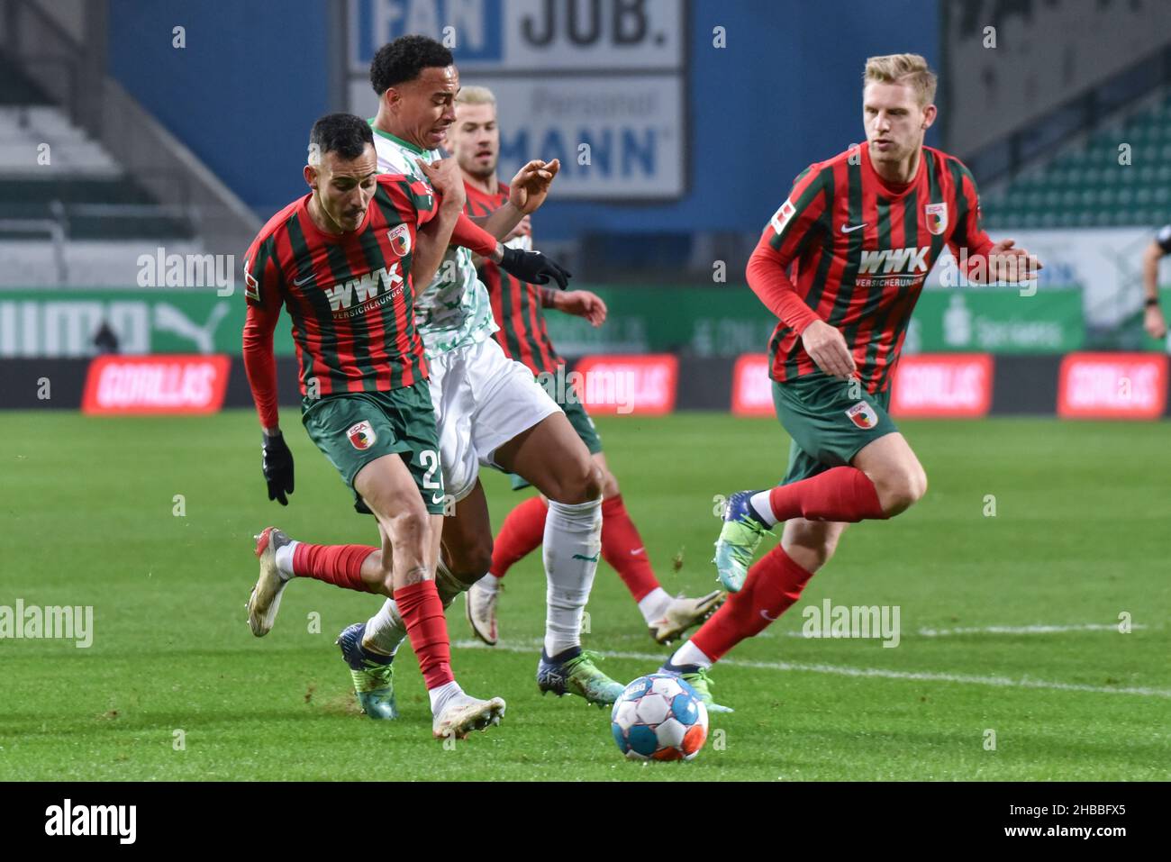 Fuerth, Germany. 18th Dec, 2021.  Fussball, 1.Bundesliga - SpVgg Greuther Fuerth vs. FC Augsburg  Image: (fLTR) Amaral Borduchi Lago (FC Augsburg, 22), Jamie Leweling (SpVgg Greuther Fürth,40)  DFL regulations prohibit any use of photographs as image sequences and or quasi-video Credit: Ryan Evans/Alamy Live News Stock Photo