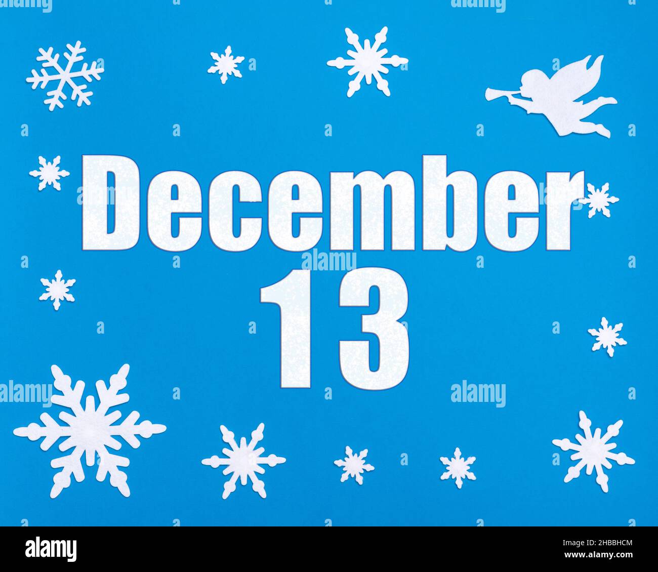 December 13th. Winter blue background with snowflakes, angel and a