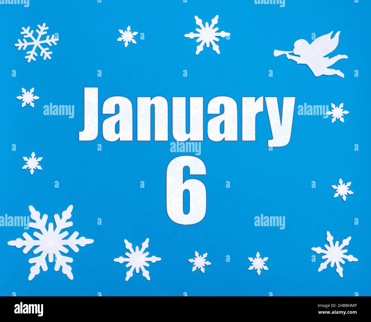 January 6th. Winter blue background with snowflakes, angel and a