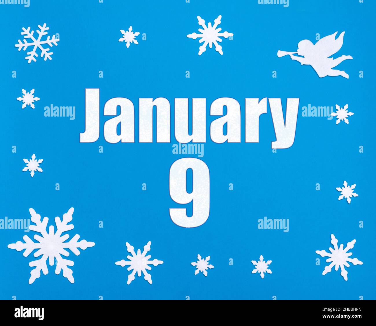 January 9th. Winter blue background with snowflakes, angel and a