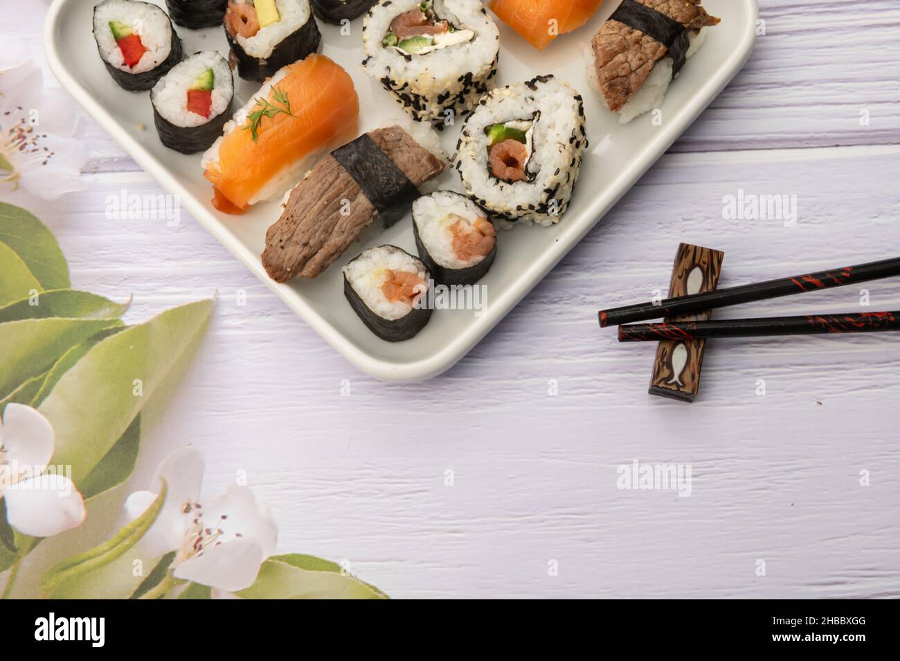 Selection of self-made nigiri and maki sushi as well as inside out rolls Stock Photo