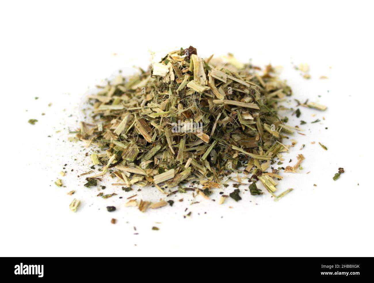 Dried chopped herb on white isolated background Stock Photo