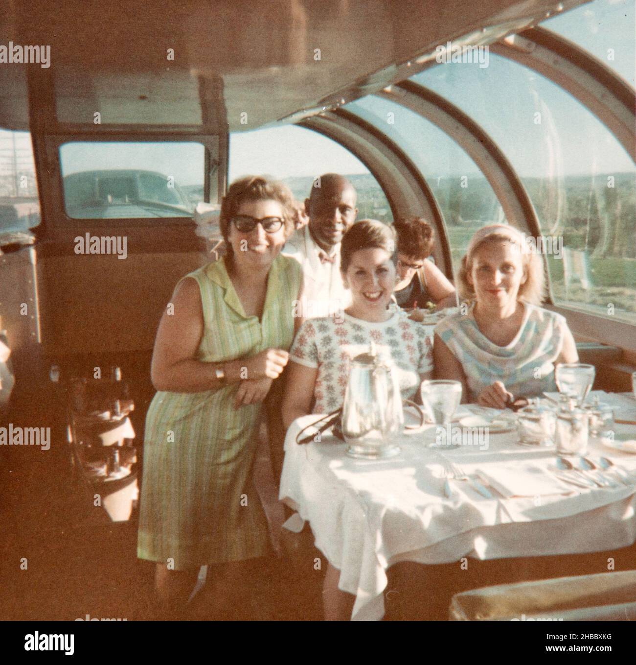 Photo of a group of italian tourists travelling USA on a panoramic train. The photo was  taken in early sixties by an italian tourist Stock Photo