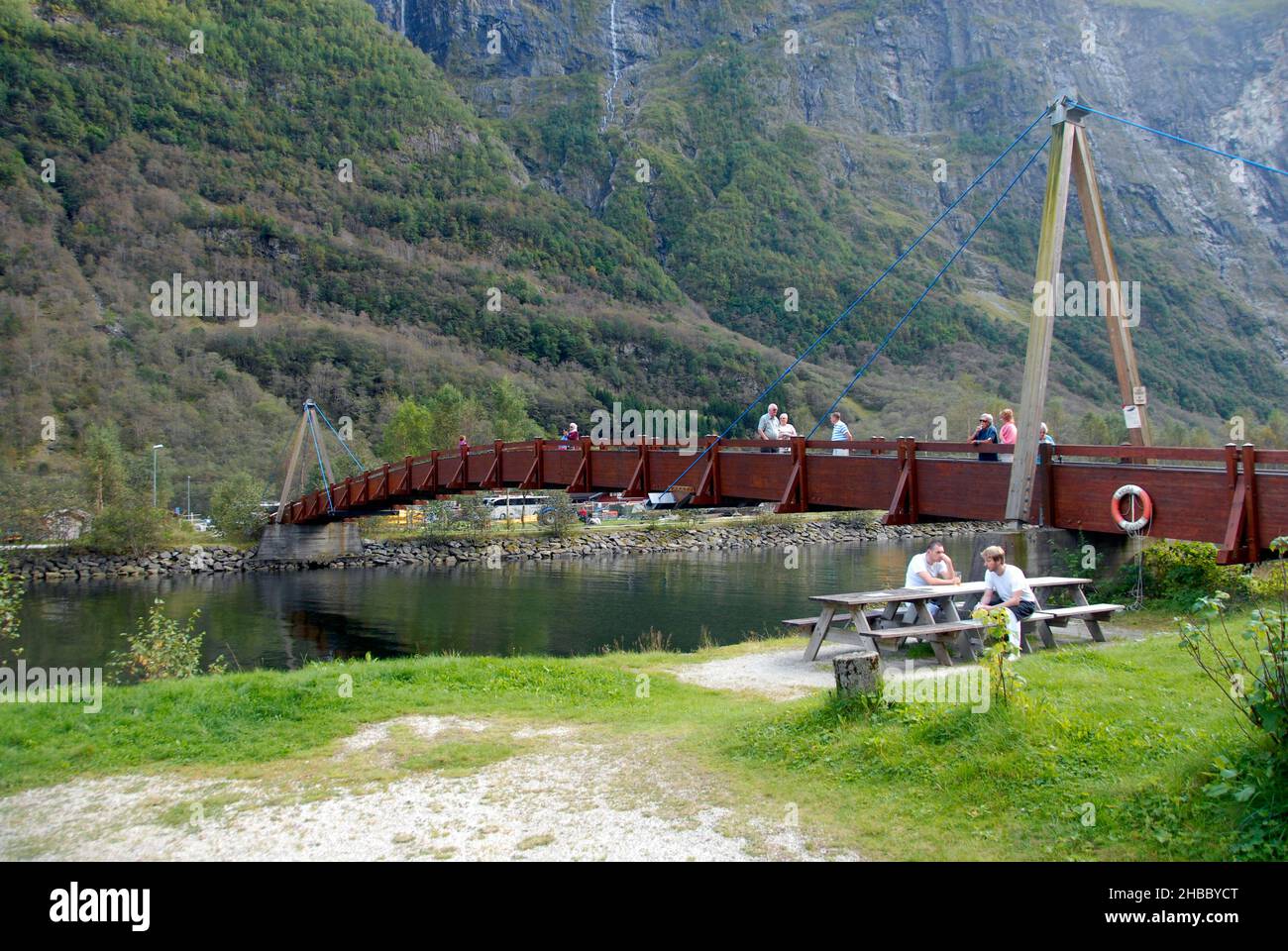 Single span footbridge, Gudvangen Fjordtell, Norway with two people sitting at a picnic table Stock Photo