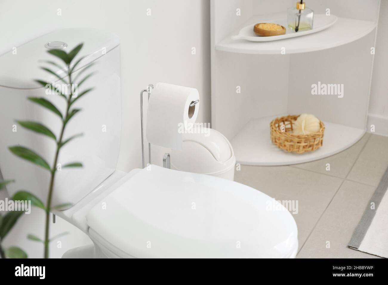 Interior of stylish modern restroom with toilet bowl Stock Photo - Alamy