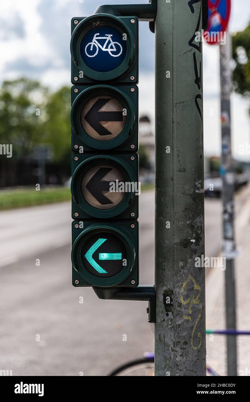 Bicycle traffic light with green light and arrow pointing to the left Stock Photo