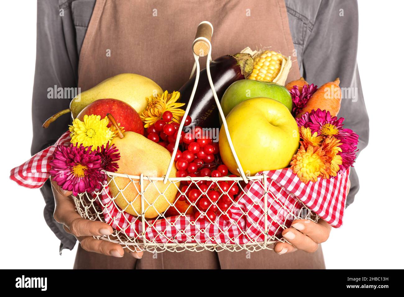 Woman holding basket with different healthy food on white background ...