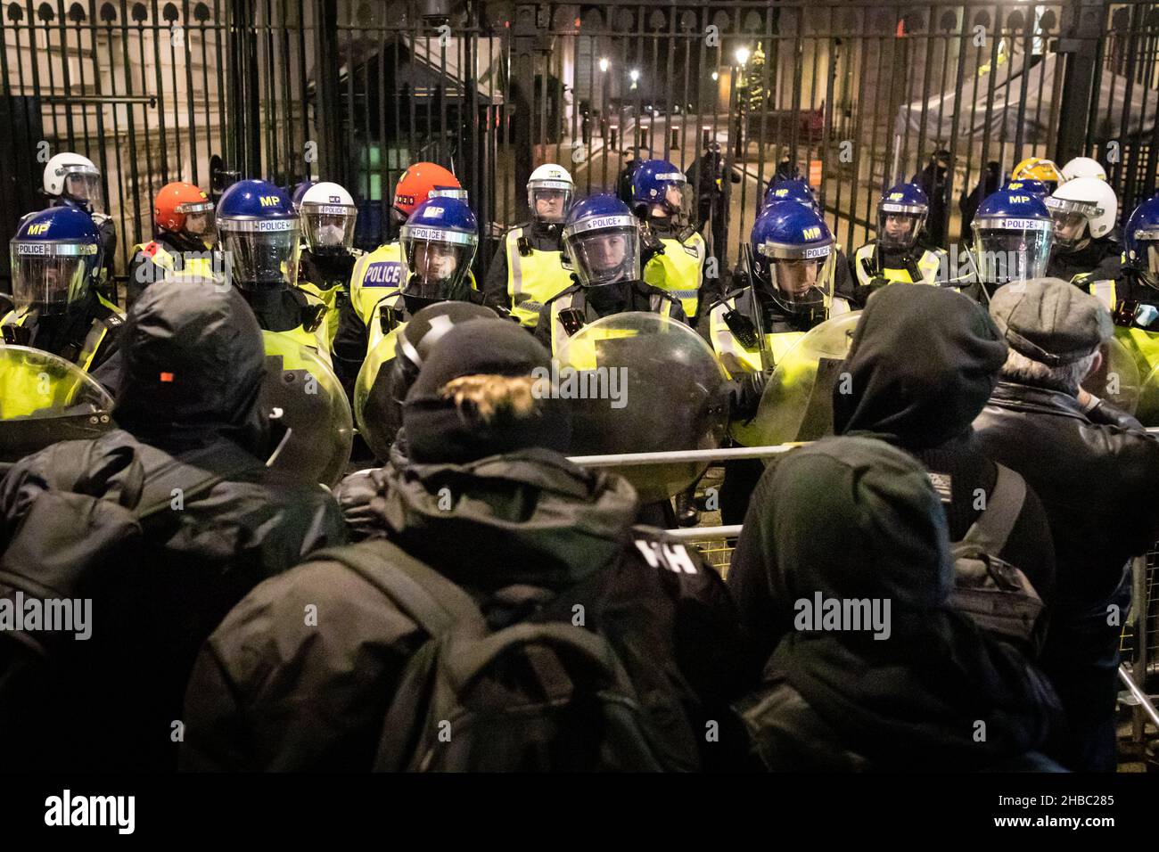 London, UK. 18th Dec, 2021. People gather outside Downing Street to protest against the latest COVID19 restrictions. Protesters unite for freedom and march through the city to show the government that they do not have faith in their leadership. Credit: Andy Barton/Alamy Live News Stock Photo