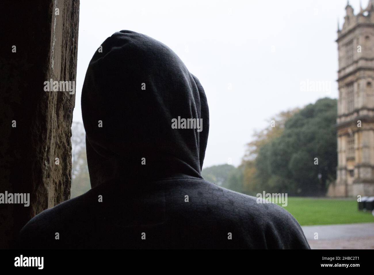 Silhouette of a Person from Behind, Standing Behind Someone Stock Photo