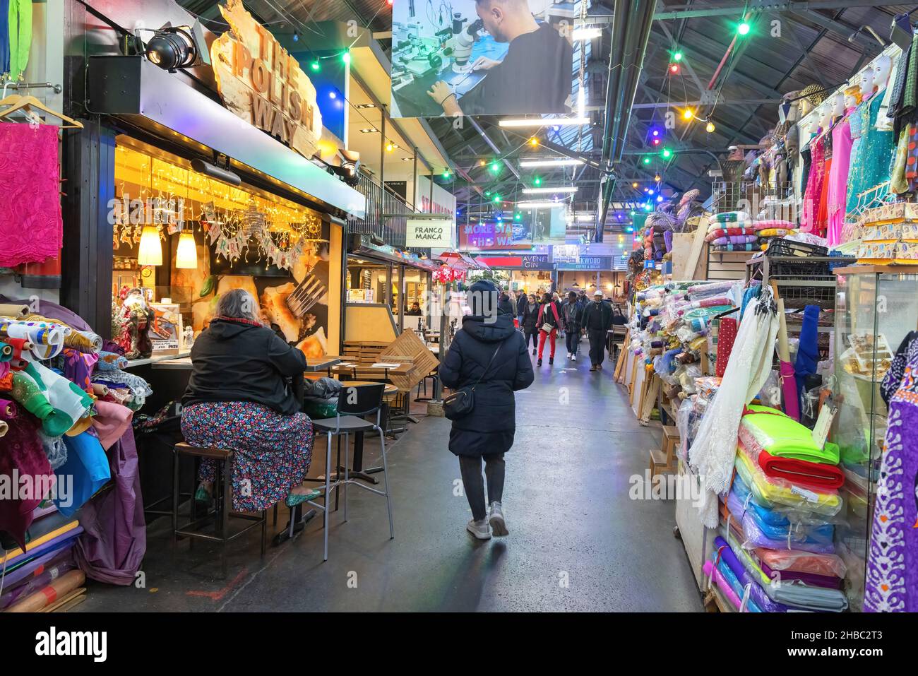 London markets; Tooting market - People shopping in the indoor market in Tooting Bec, London SW17, London UK; example of city lifestyle, England Stock Photo