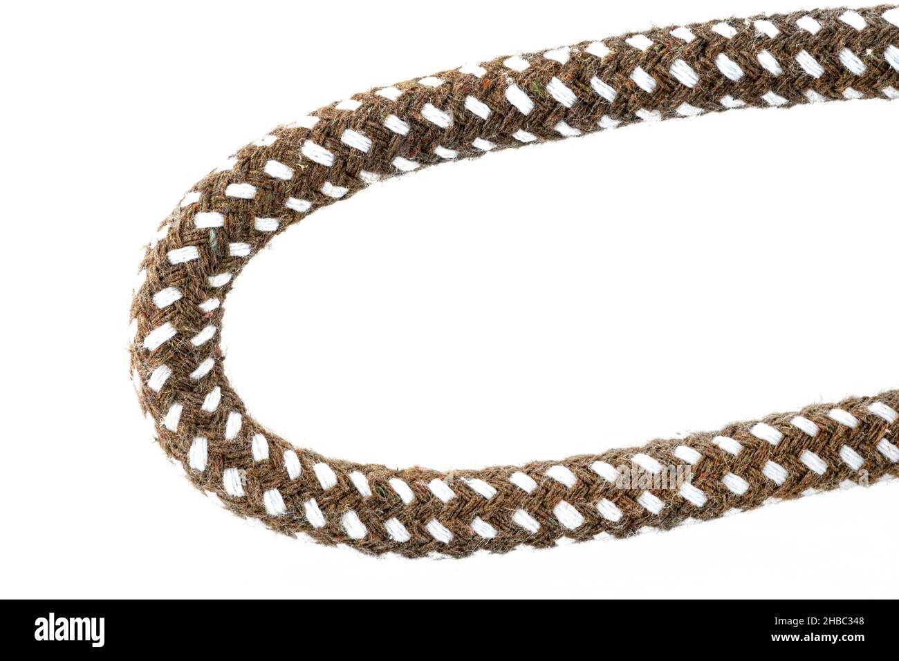 Macro photo of a brown rope with white details made of cotton and jute ...