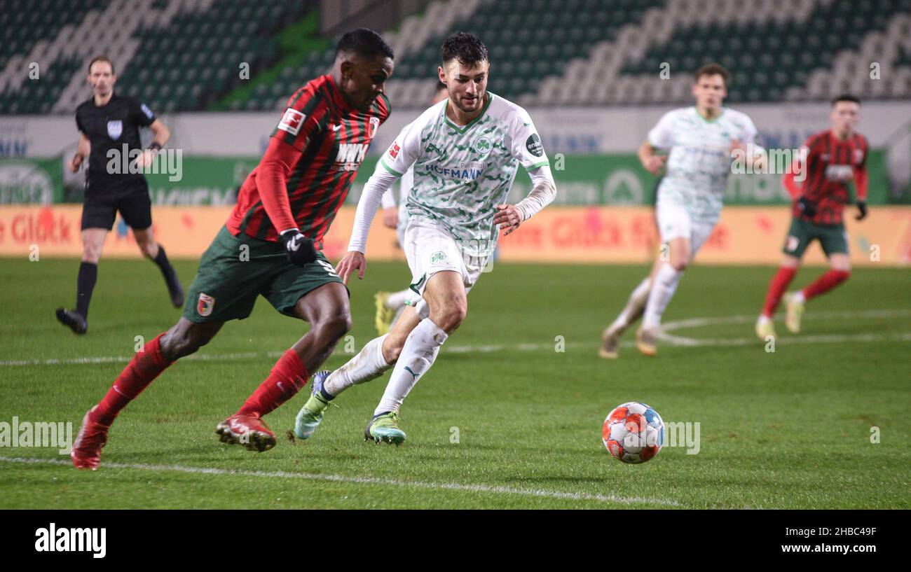 Germany ,Fuerth, Sportpark Ronhof Thomas Sommer - 18 Dec 2021 - Fussball, 1.Bundesliga - SpVgg Greuther Fuerth vs. FC Augsburg  Image: (fLTR) Sergio Cordova (FC Augsburg, 9), Maximilian Bauer (SpVgg Greuther Fürth,4)  DFL regulations prohibit any use of photographs as image sequences and or quasi-video Credit: Ryan Evans/Alamy Live News Stock Photo