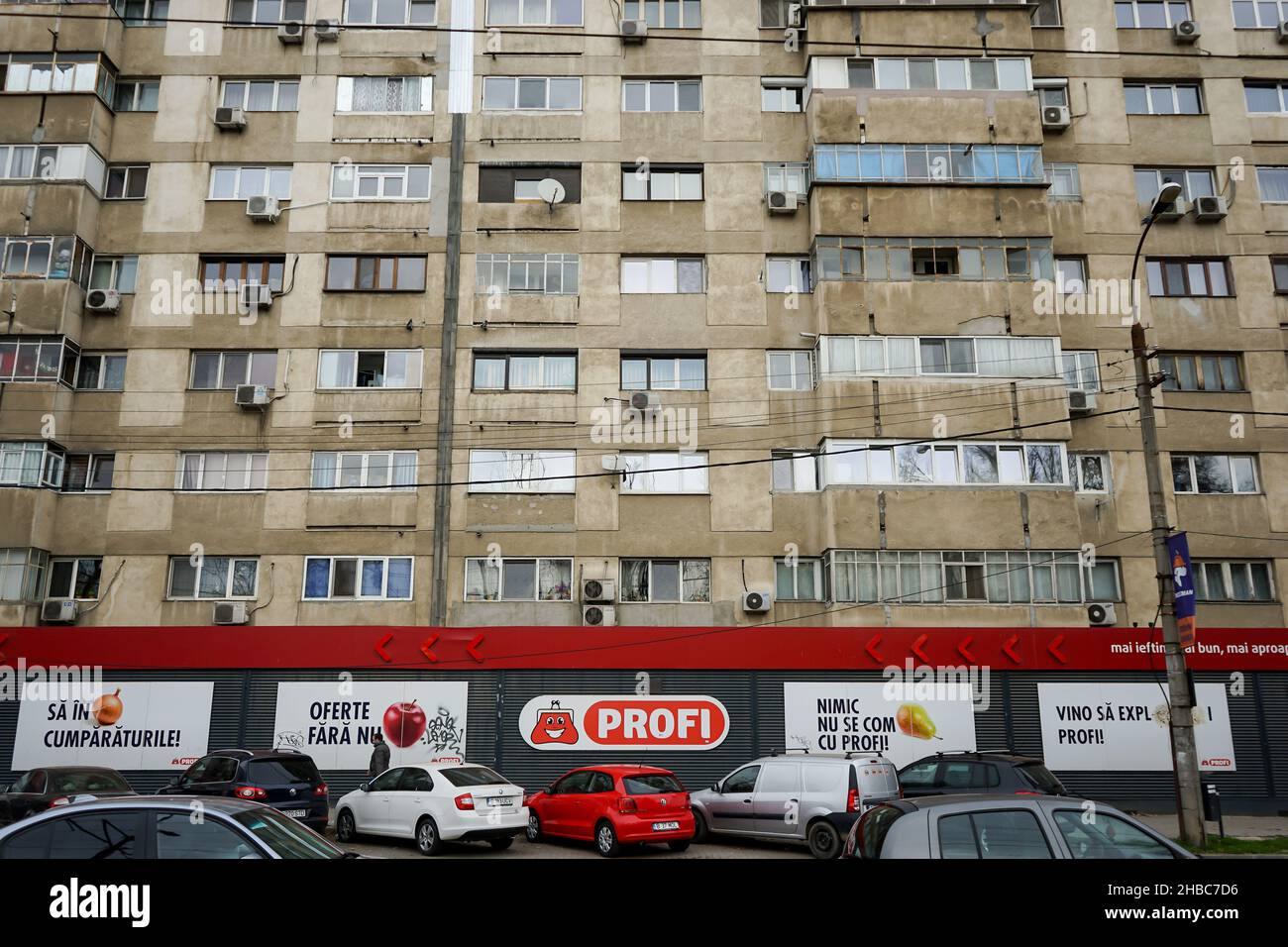 Bucharest, Romania - December 03, 2021: A Profi supermarket on the ground floor of a large block of flats in the Bucharest Gencea neighborhood, in Buc Stock Photo