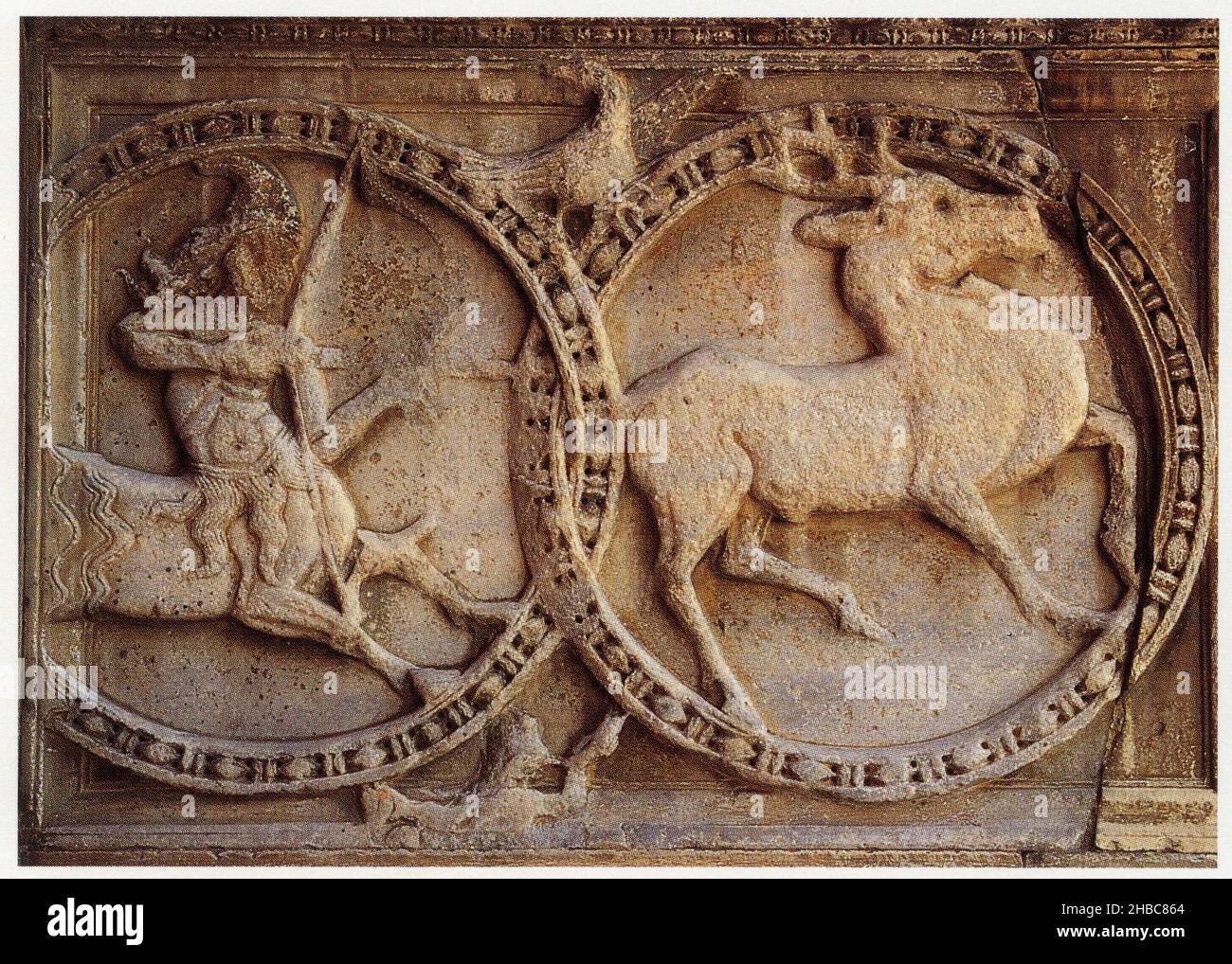 Abbatiale Saint-Gilles-du-Gard.Bas-relief de la façade représentant un cerf se cabrant devant un centaure Stock Photo