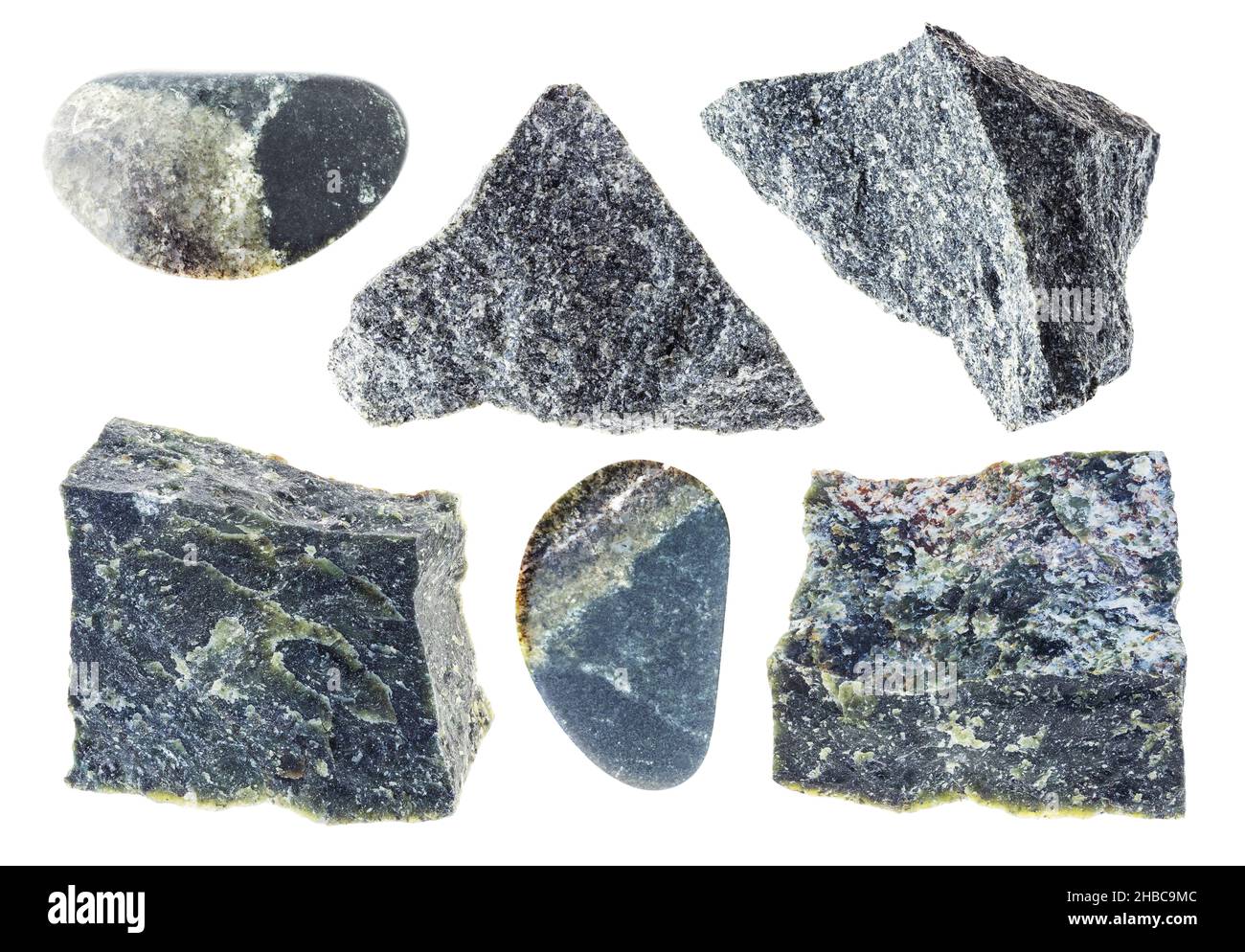 set of various dunite (olivinite) stones cutout on white background ...