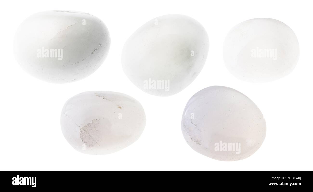set of various polished milky quartz stones cutout on white background
