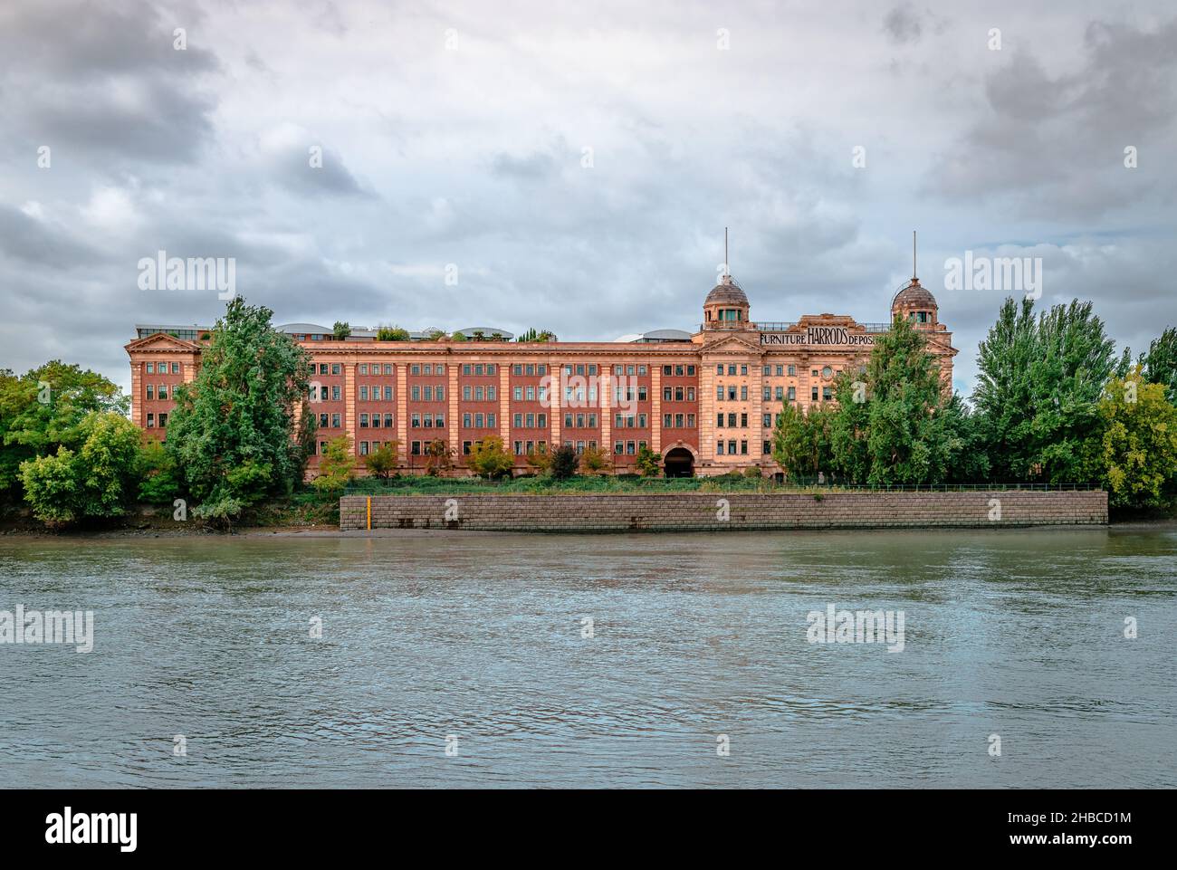 The Harrods Furniture Depository buildings on the south bank of the River Thames, in Barnes. Once a storage center, now  residential estate. Stock Photo