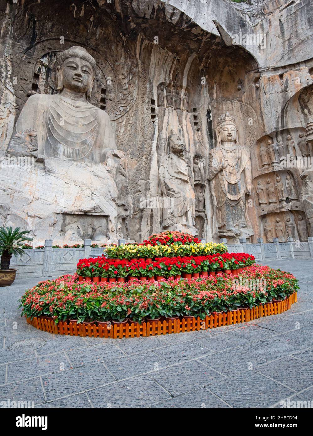 Famous Longmen Grottoes (statues of Buddha and Bodhisattvas carved in the monolith rock near Luoyang in Hennn province, China) Stock Photo