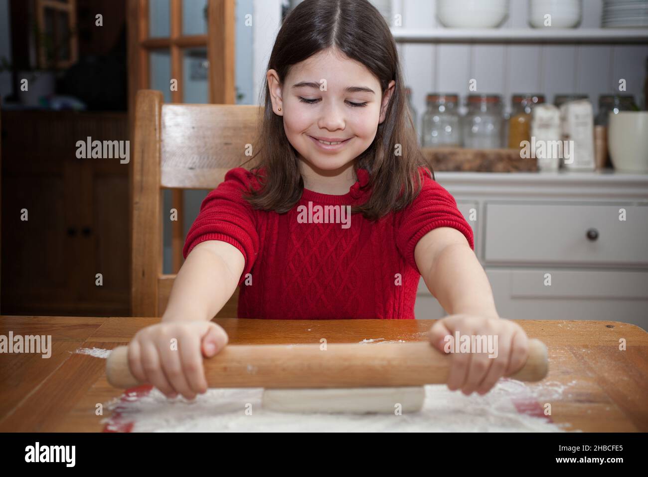 A girl rolling pastry Stock Photo Alamy