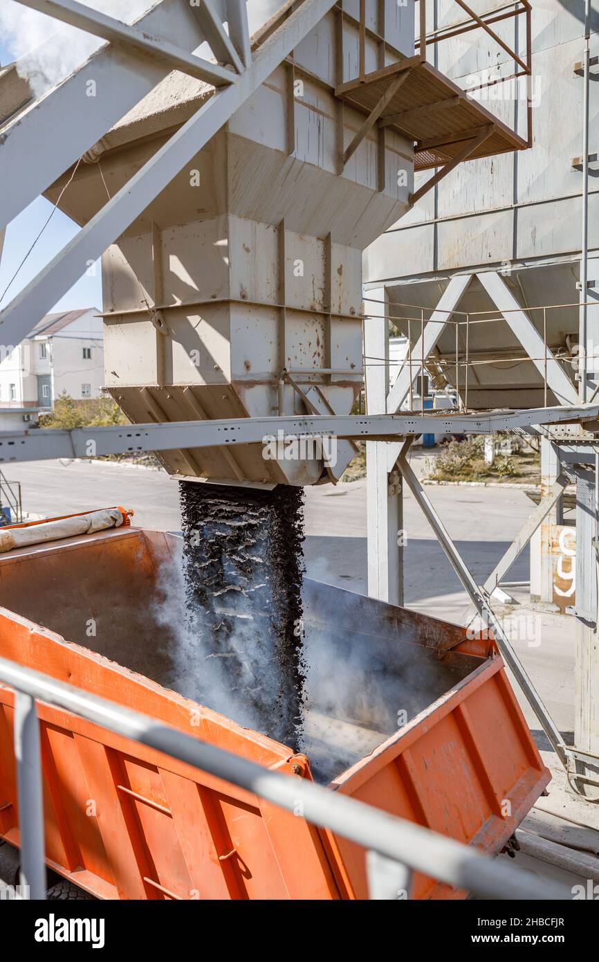 Photo of loading process of construction material at factory Stock Photo