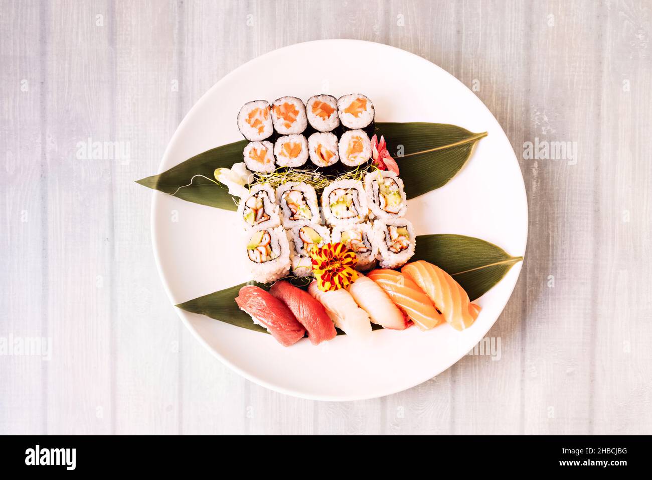 Assorted round sushi plate with maki, hosomaki, california uramaki