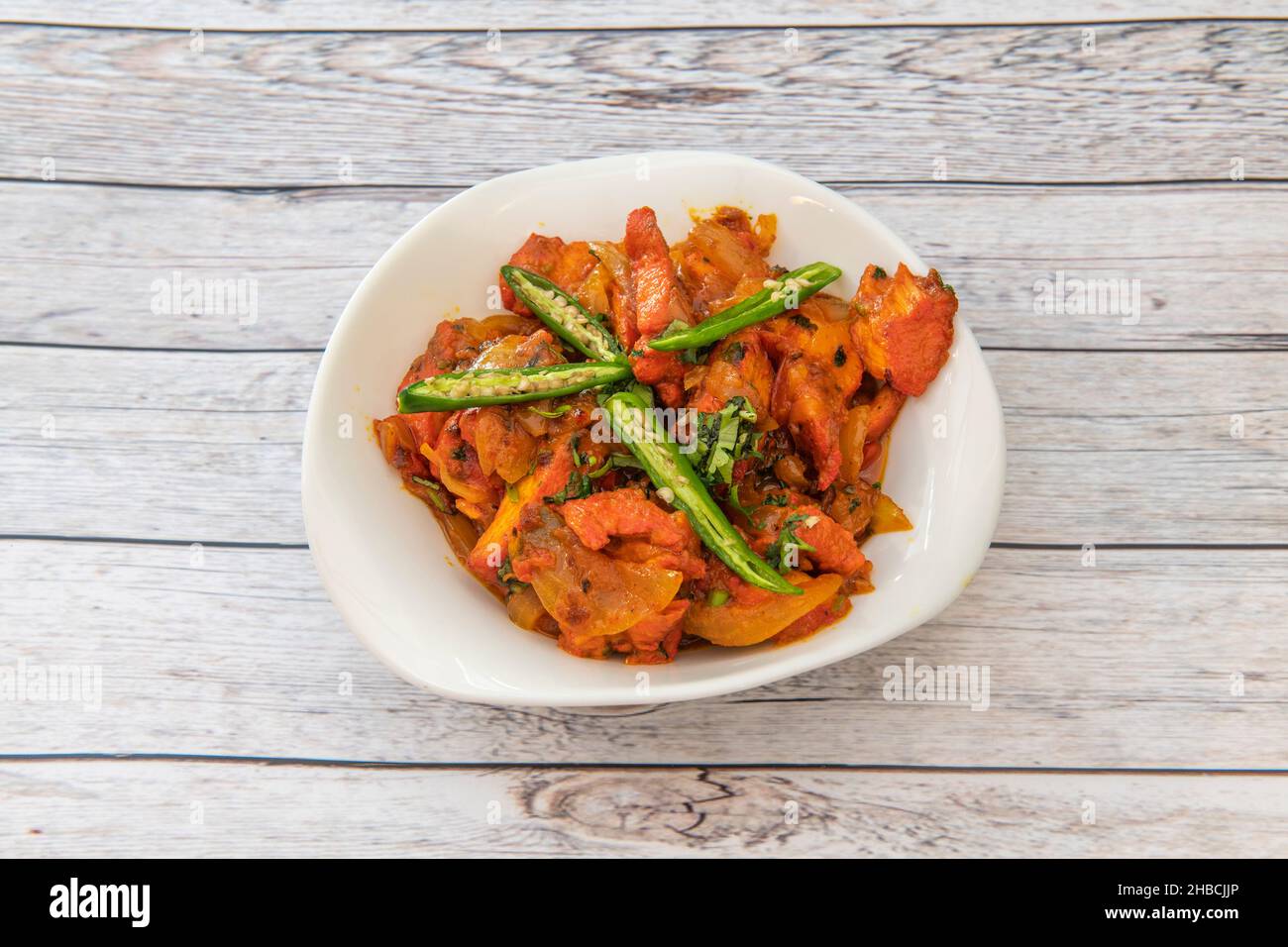Jalfrezi means quick fry, born as a spicy dish from the British Raj era, cooked with chicken, bell peppers, onions, green chilies, it is now one of th Stock Photo
