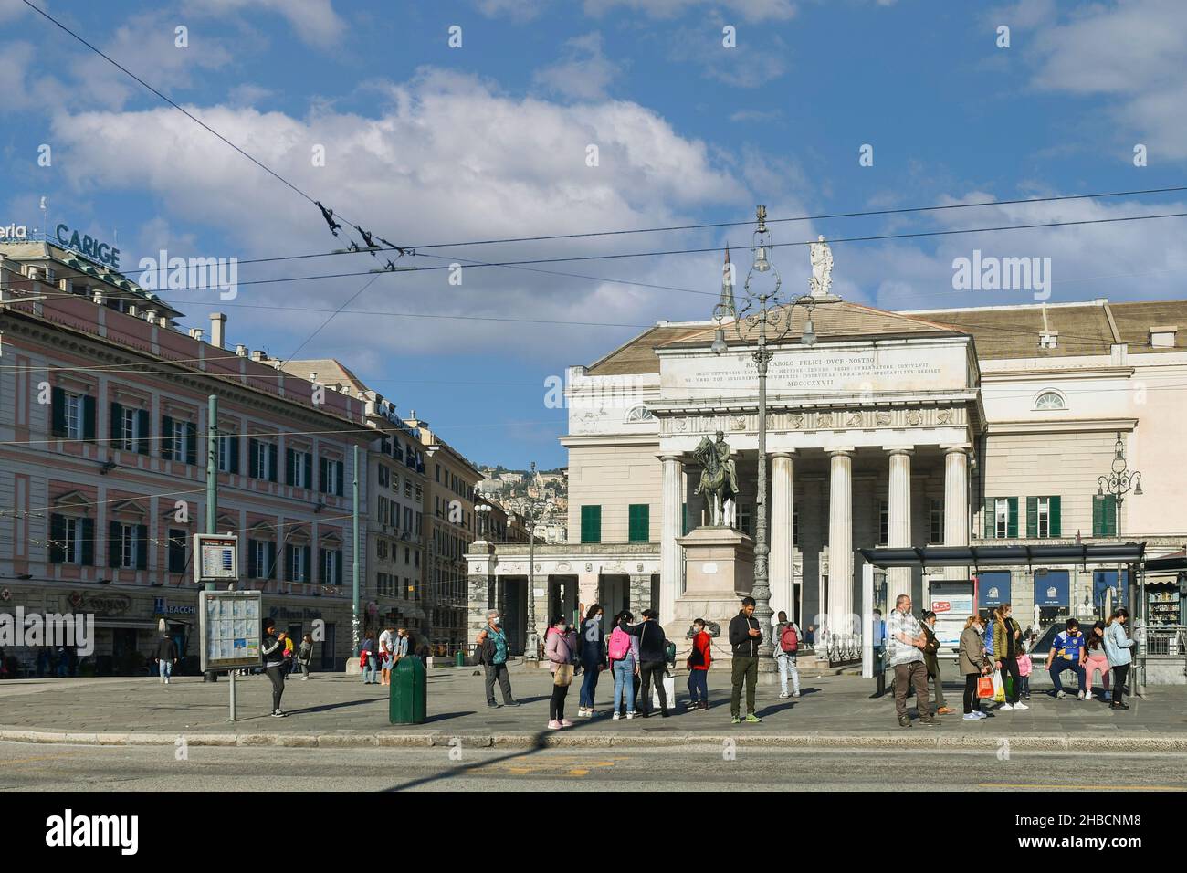 Façade of the Carlo Felice Theatre in the city center with the equestrian statue of Giuseppe Garibaldi and people in autumn, Genoa, Liguria, Italy Stock Photo