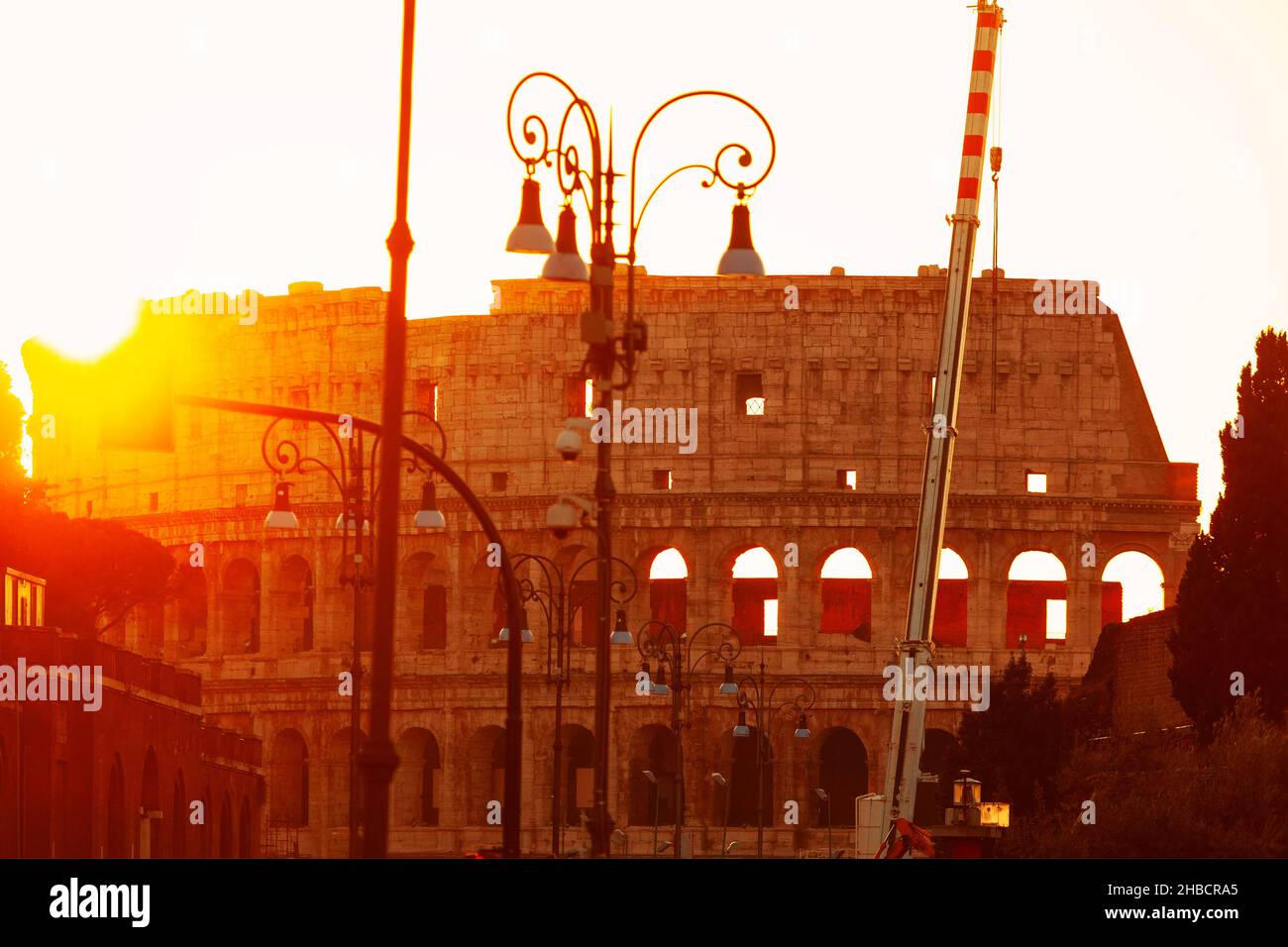 Sunrise over Colosseum in Rome . Reconstruction of antique architecture Stock Photo