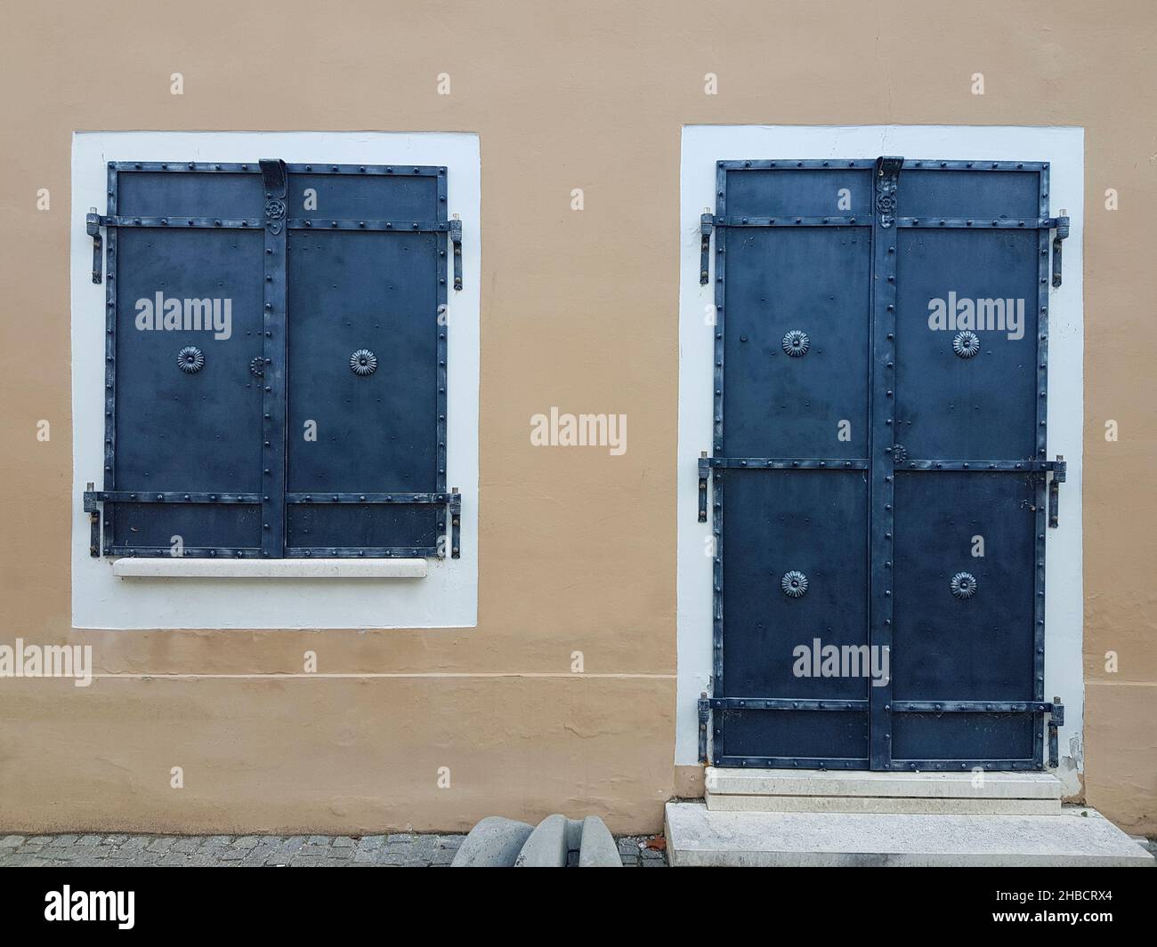 Metal shutters for door and window with forged details. Stock Photo