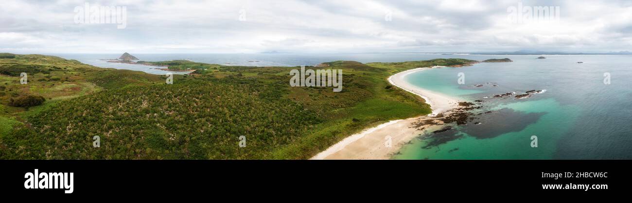 Pacific ocean shore around Broughton island off NSW coast - aerial panoramic seascape. Stock Photo