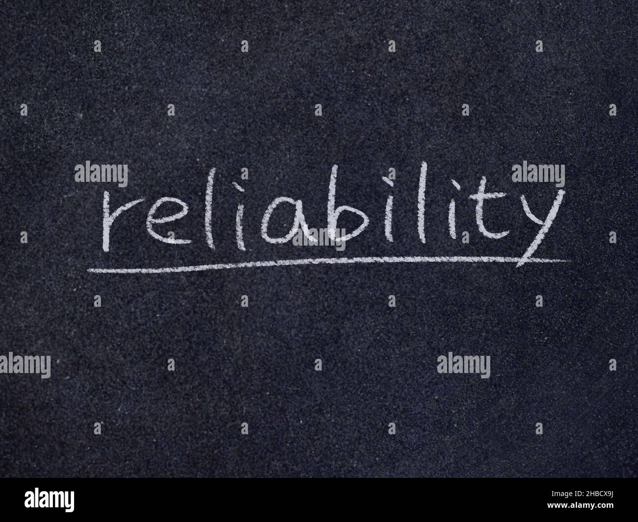 reliability concept word on blackboard background Stock Photo