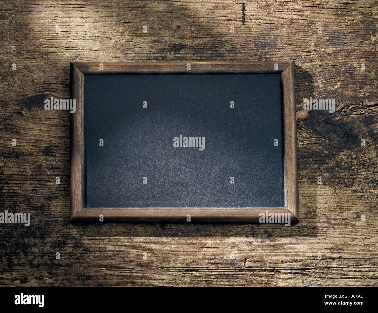 blackboard frame on wooden table background, top view Stock Photo