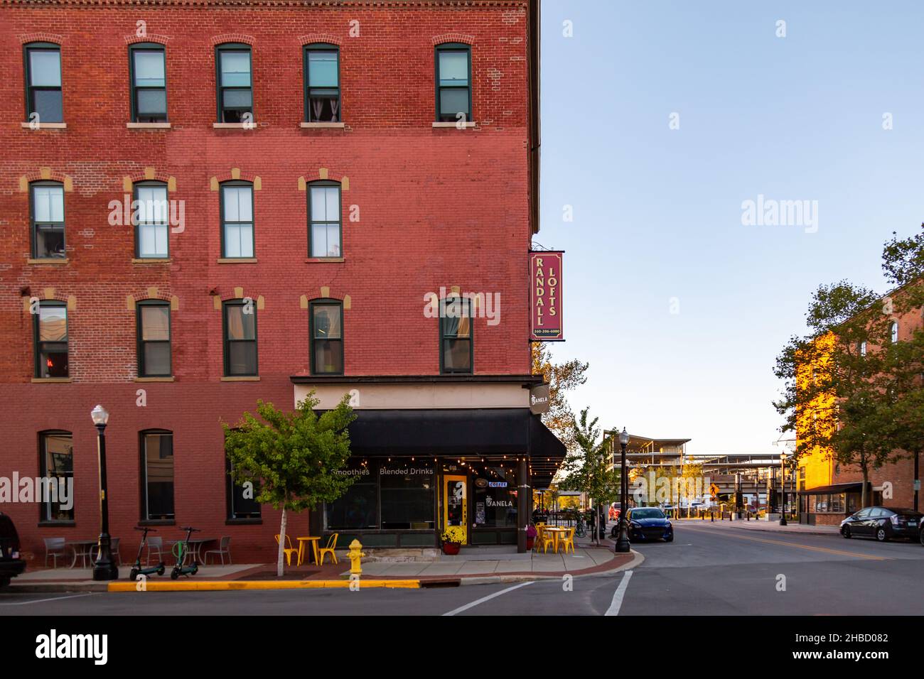A coffee shop occupies the first floor corner of the Randall Lofts