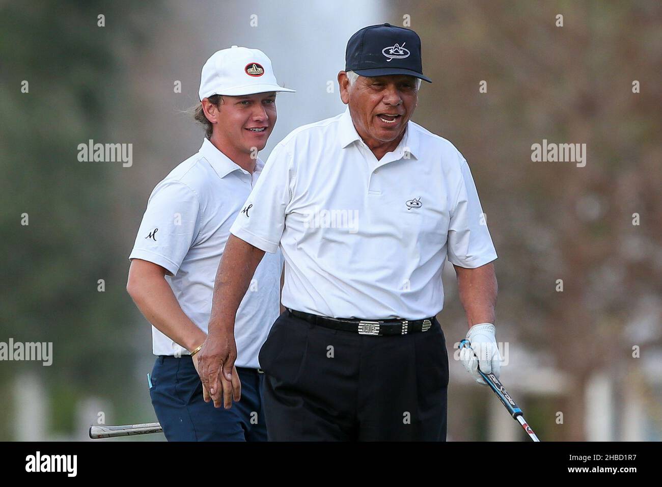Orlando, Florida, USA. 18th Dec, 2021. Daniel Trevino (L) and his father Lee  Trevino on the 18th green during the first round of the PNC Championship at  the Ritz-Carlton Golf Club in