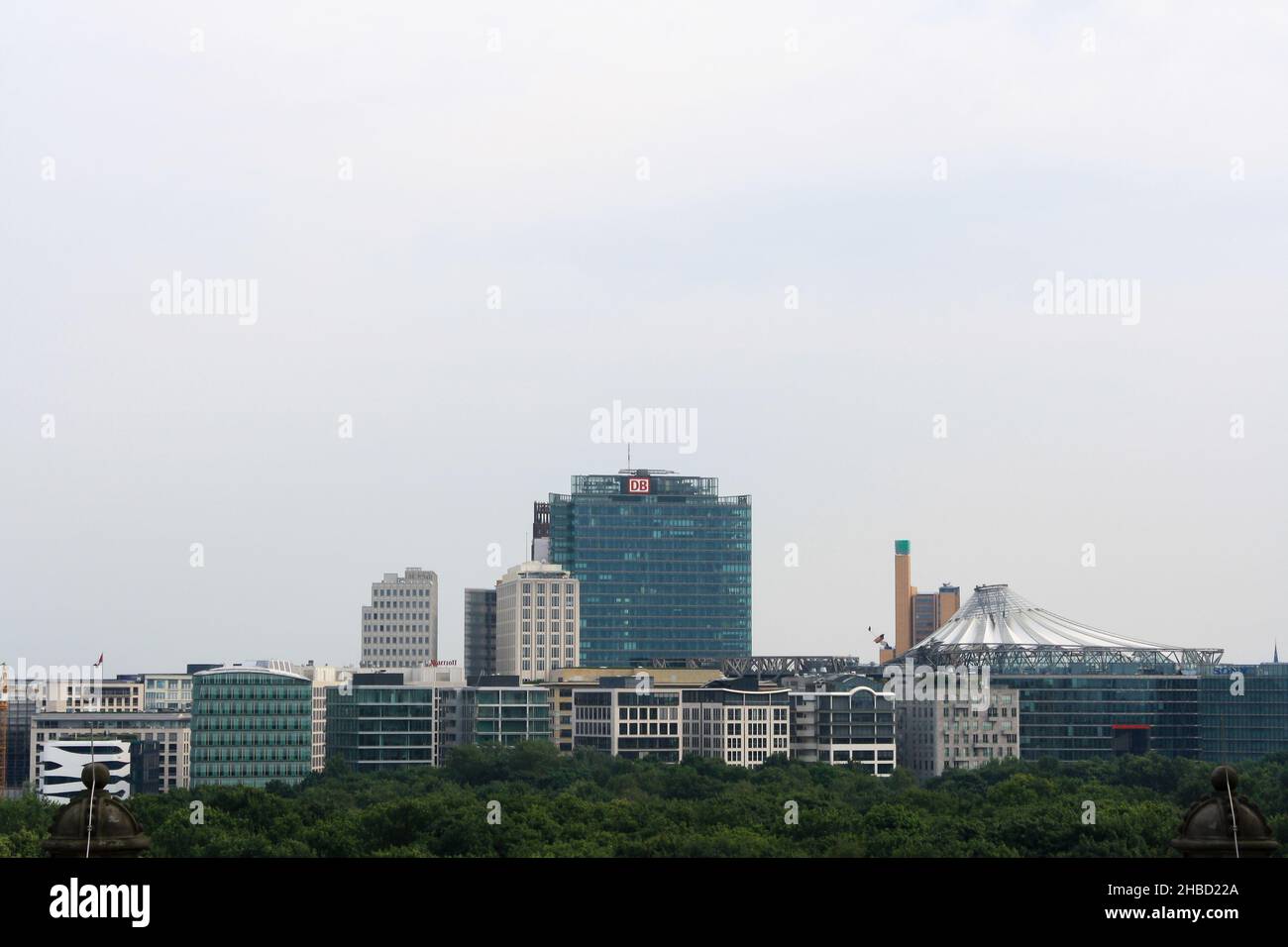 Berlin cityscape in summer with Deutsche Bahn building and Sony Center view from rooftop of Reichstag. Clear blue sky background. No people. Stock Photo
