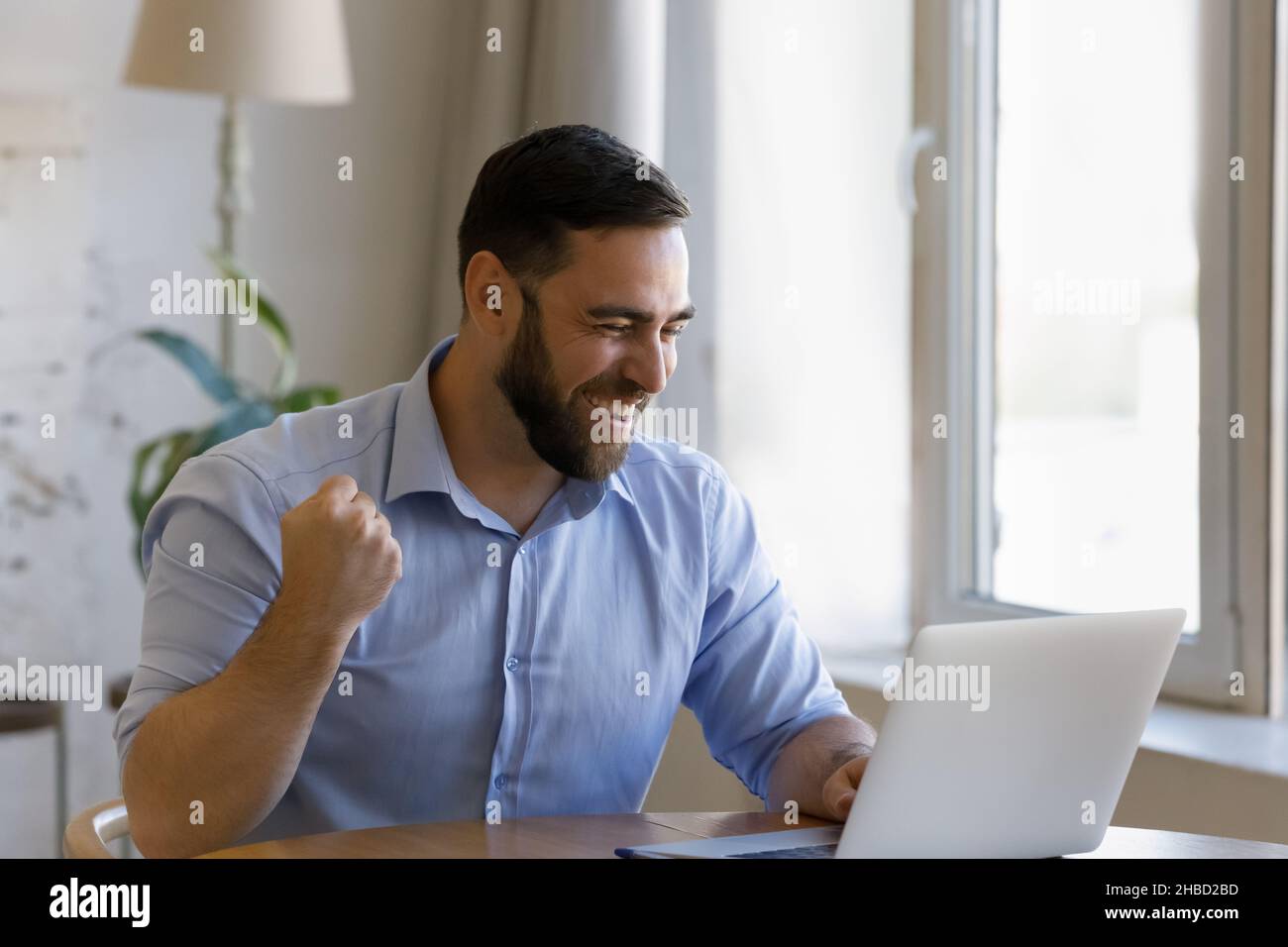 Happy young man celebrating hi-res stock photography and images - Alamy