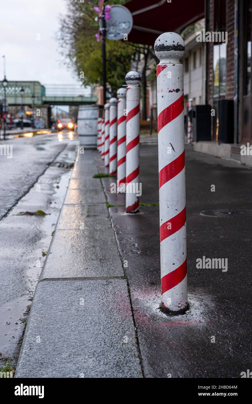 Paris, France - 11 27 2021: Canal de l'Ourcq. Painted post with a figurine Stock Photo