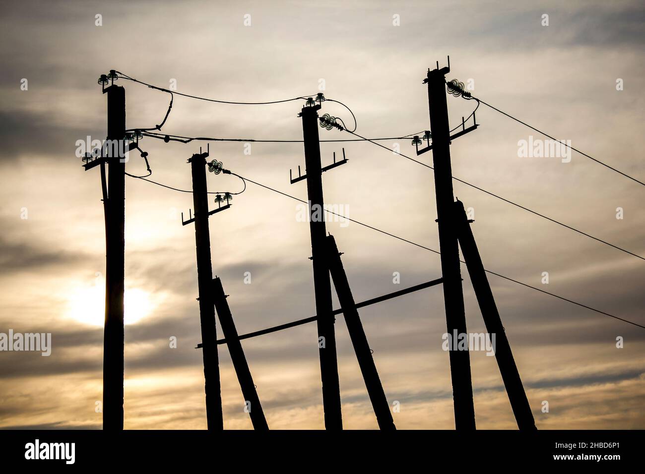 Electricity transmission pylon view against the sky during sunset Stock ...