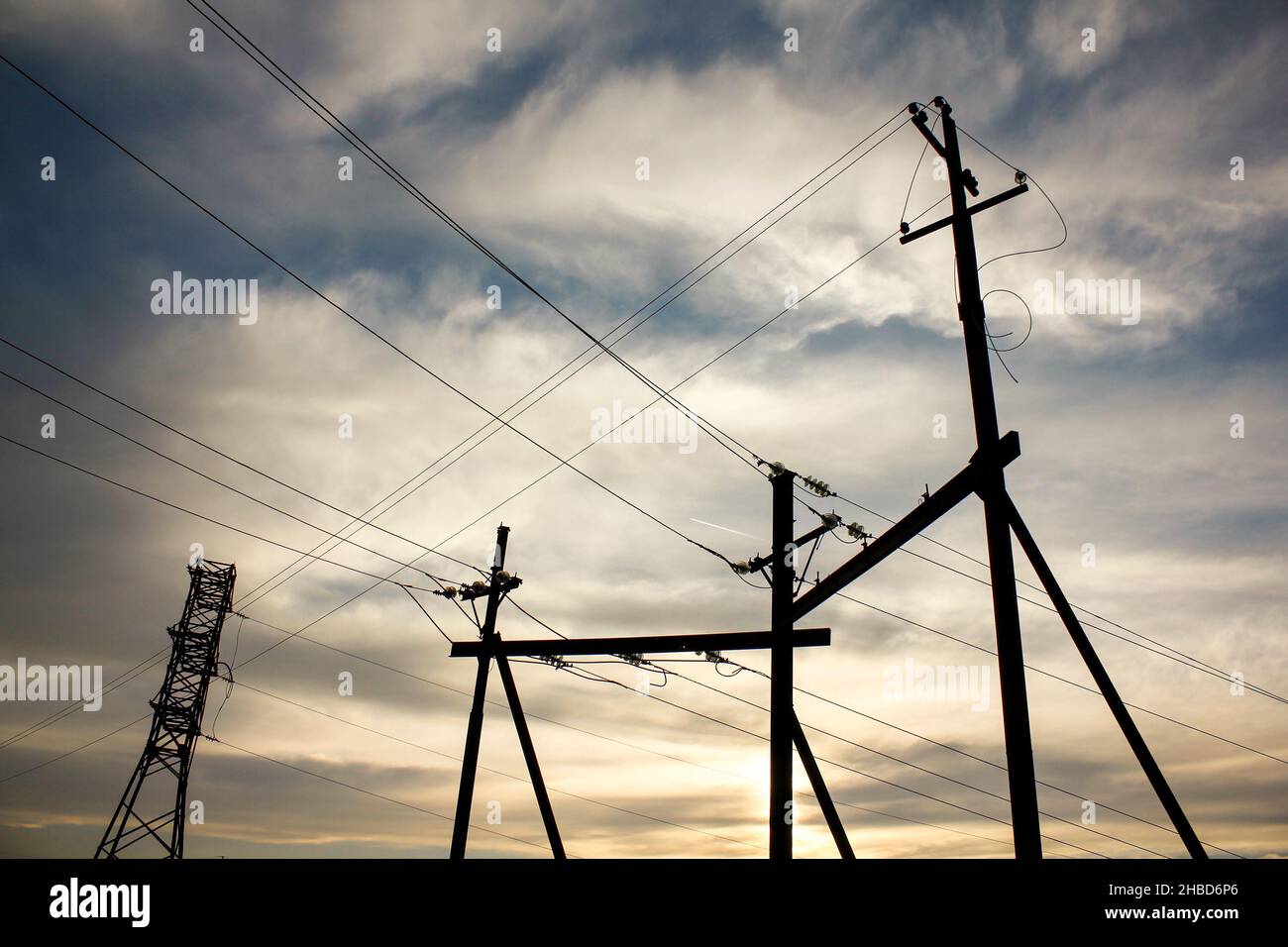 Electricity transmission pylon view against the sky during sunset Stock ...