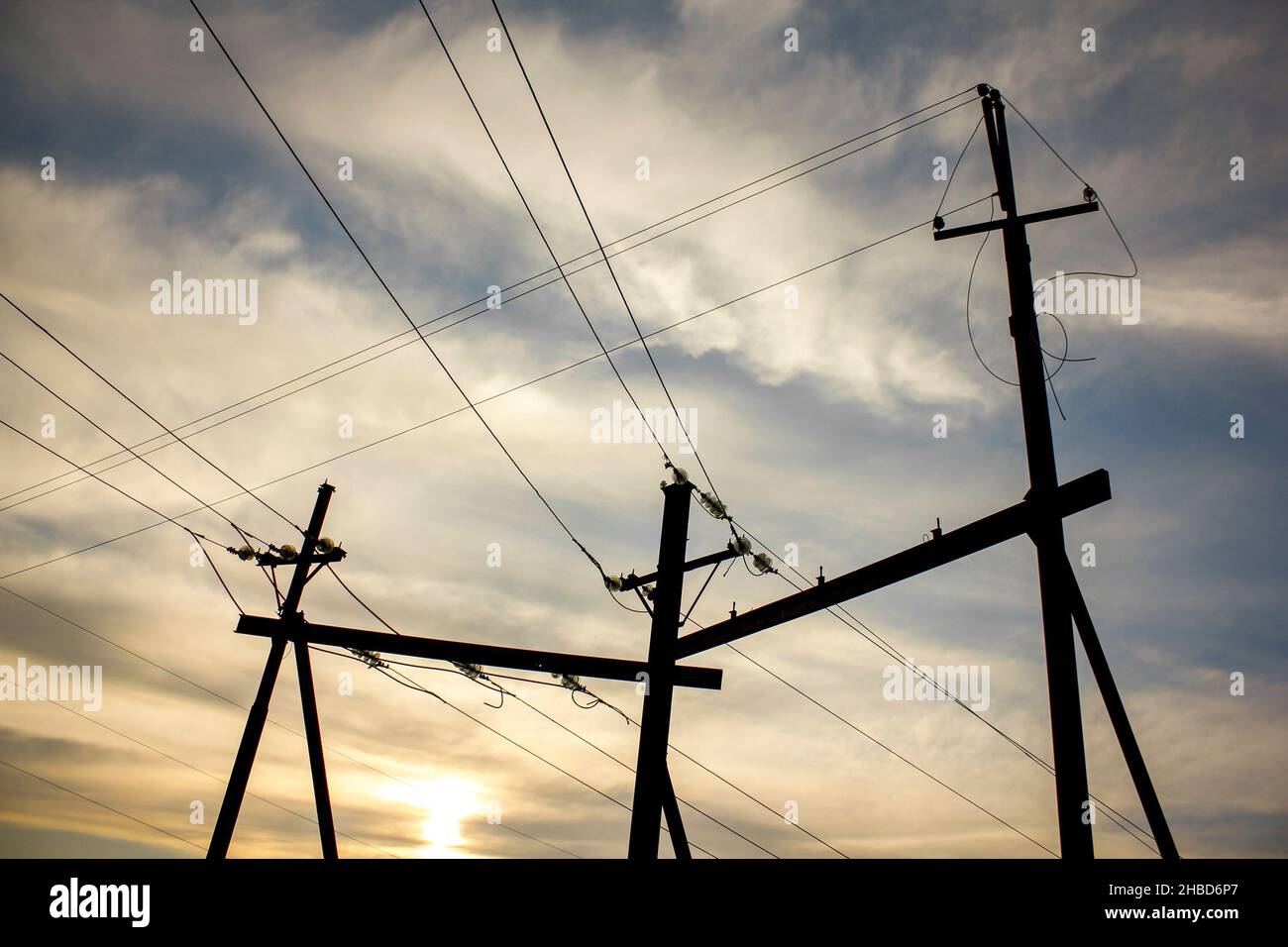 Electricity transmission pylon view against the sky during sunset Stock ...