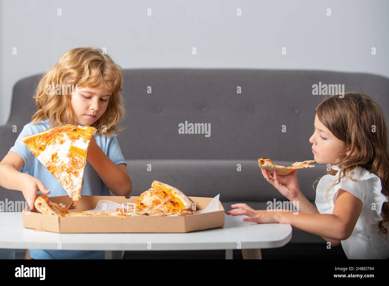 Pizza and kids, slices pizza in kids hand. Children eating tasty fast