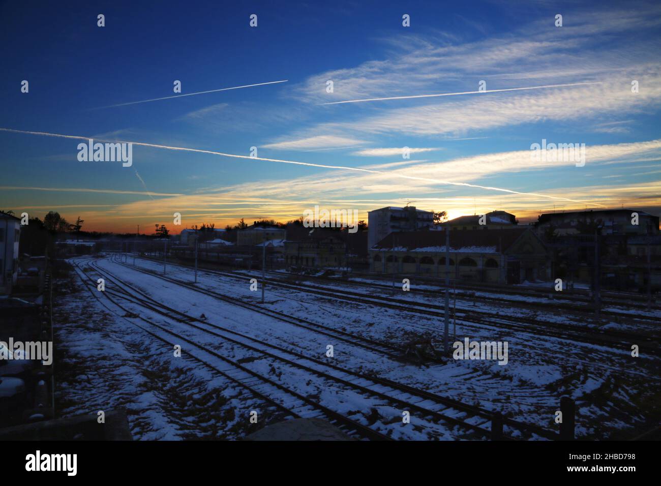 Railway with snow, under sunset blue light , horizontal image Stock ...