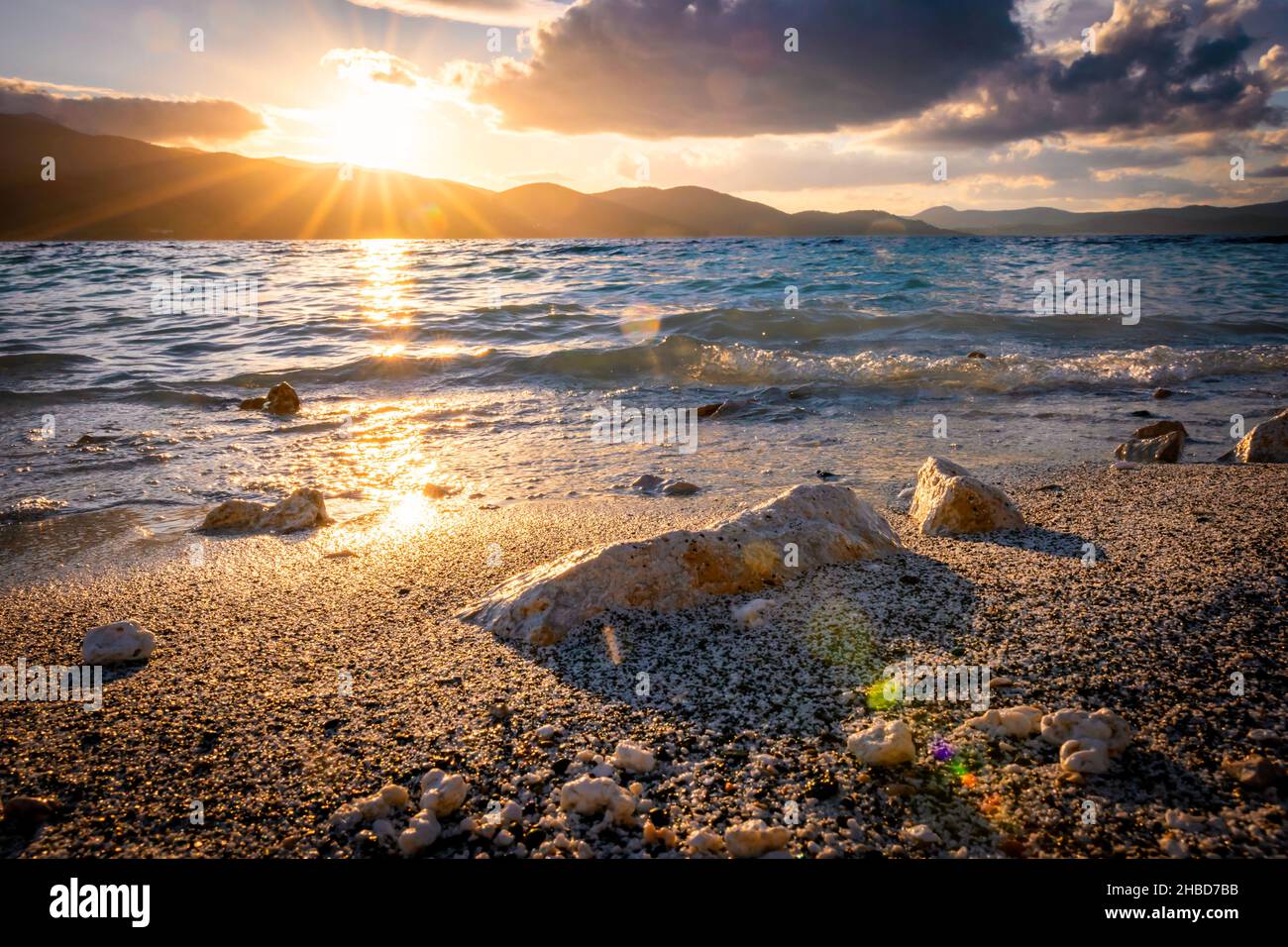 crashing-wave-to-the-rock-and-salda-lake-during-the-sunset-and-windy
