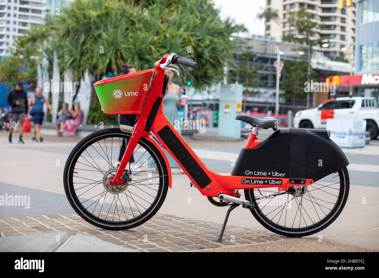 Lime uber ebike rental on the esplanade surfers paradise Stock Photo