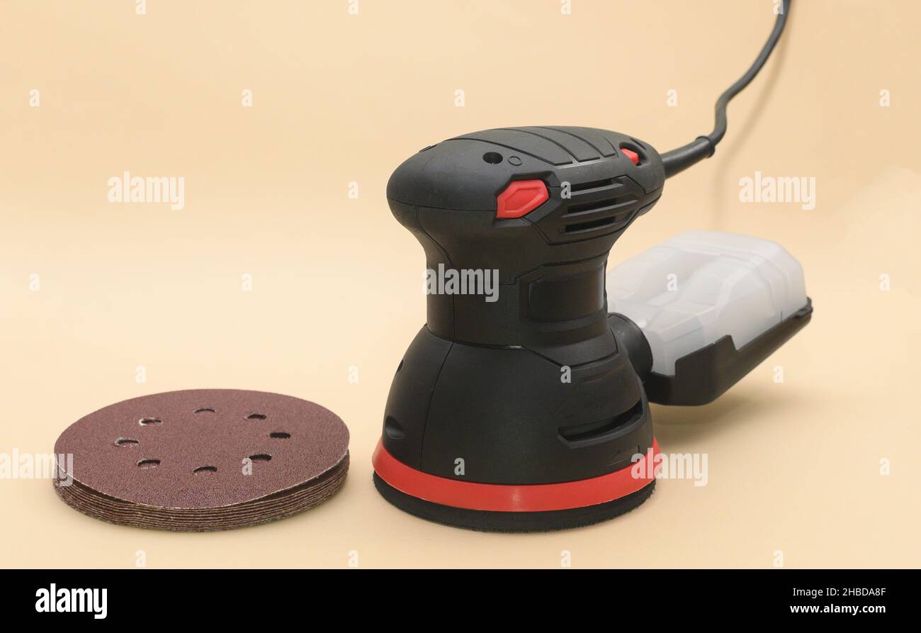 Eccentric orbital sander, with grinding wheels. grinder machine Stock