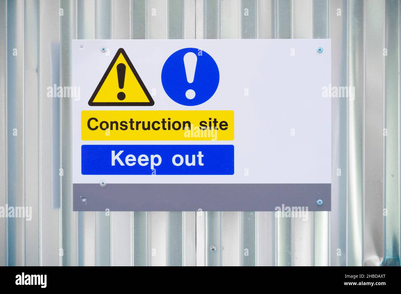 Construction site health and safety message rules sign board signage on fence boundary Stock