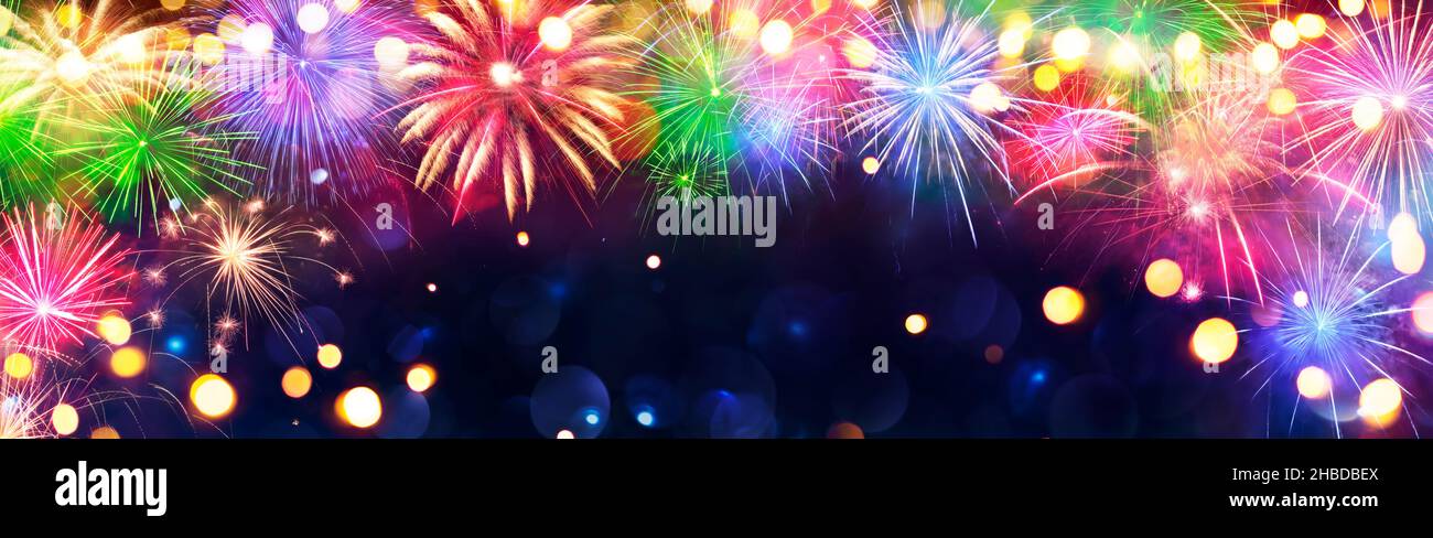 Fireworks - Anniversary Celebration With Colorful Lights In Blue Night With Glittering - Abstract Defocused Bokeh Stock Photo