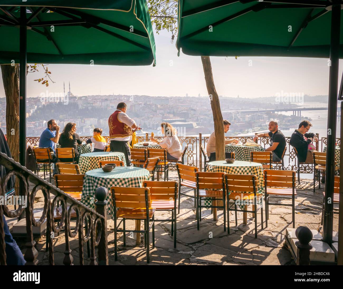 Tourist sits in Pierre Loti cafe on the hilltop with stunning views of