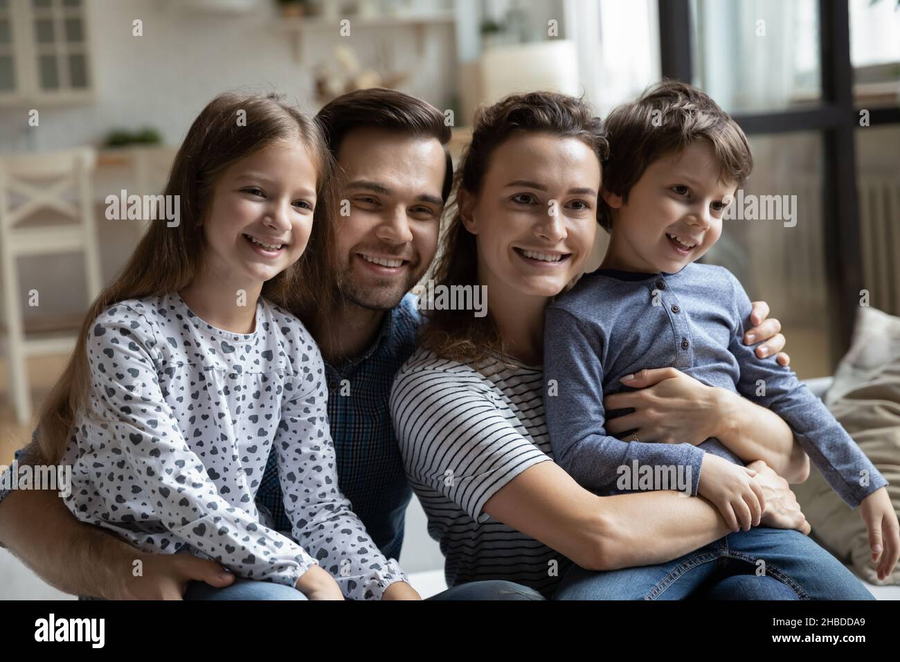 Head shot portrait happy family with two children at home Stock Photo