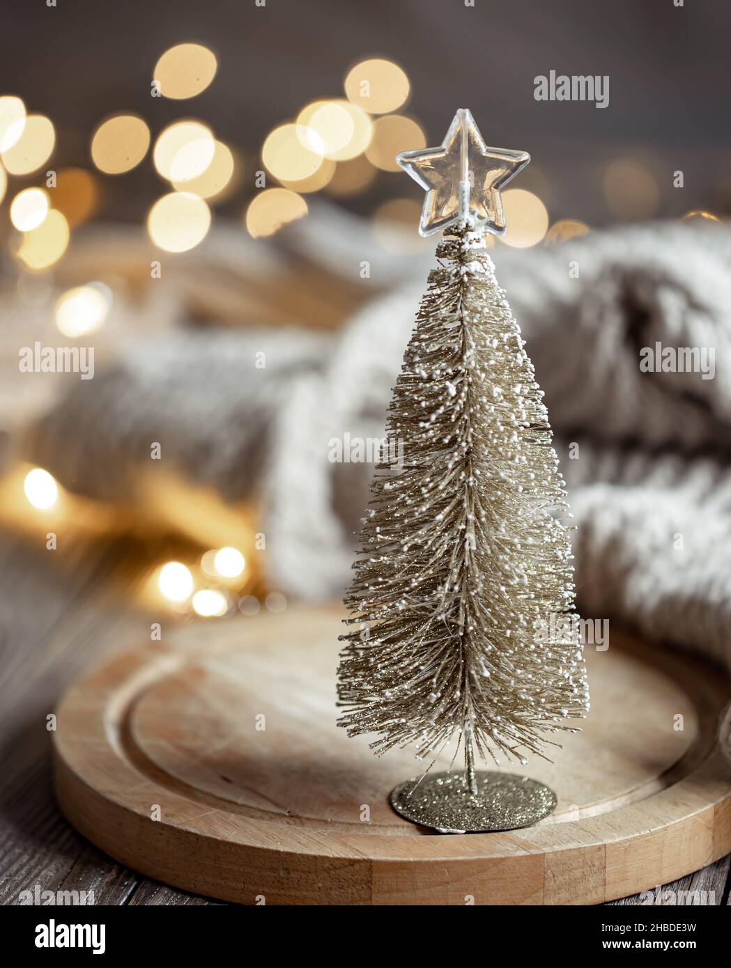 Decorative Christmas tree on blurred background with bokeh. Stock Photo